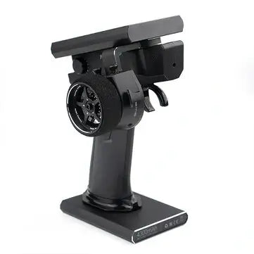 Flysky Noble NB4 2.4GHz RC transmitter with a steering wheel and touch screen, designed for RC cars and boats.
